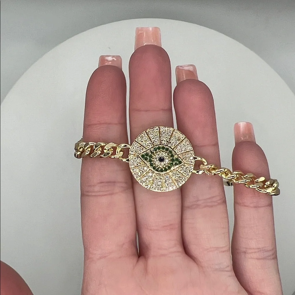 045. 18k Gold Plated Evil Eye Bracelet with green accents 7 1/4”